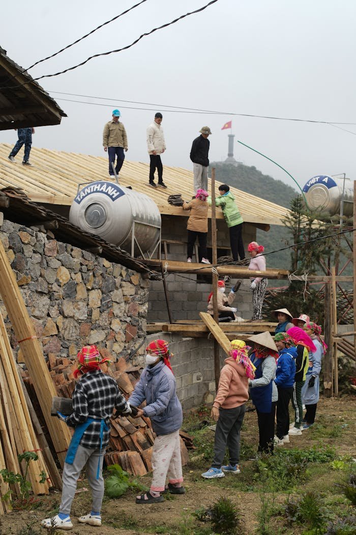 A group of people working together on rural construction in Ha Giang, Vietnam.